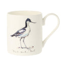 An off-white ceramic mug featuring a watercolor illustration of an Avocet.