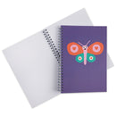 A purple spiral notebook featuring a colorful butterfly graphic on the cover, photographed against a plain white background.