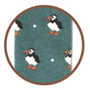 Bartleby’s green Funky Welly Socks with close up of repeating pattern of puffins. 