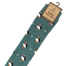 Bartleby’s green Funky Welly Socks with a repeating pattern of puffins. 