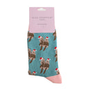 Pair of teal socks featuring a pair of otters wearing festive hats