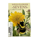 Wild Flower Sevens Card Game box featuring a yellow flower, green leaves, and a bumblebee on the front cover, with a choking hazard warning label on the lower left.