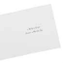 Christmas card shown open at an angle, featuring the handwritten text 'With best wishes for Christmas and the New Year' in black ink on the right side.