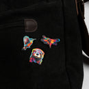 WWT Set of three wooden pin badges including an otter. kingfisher and dragonfly on a black bag